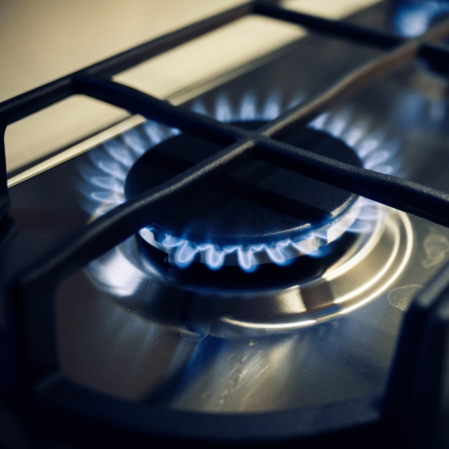 Gas cooktop burner with blue flame gas fitting services Sunshine Coast