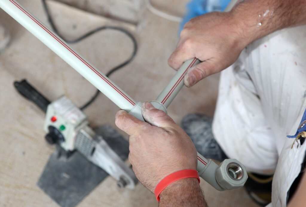 Licensed Sunshine Coast plumber installing PEX water pipes and fittings